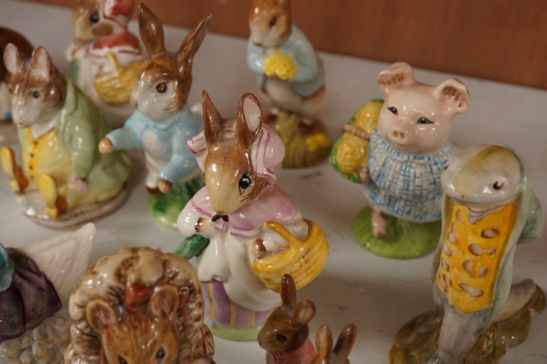 Twenty Beatrix Potter figures, mostly later production figures, largest 11cm high